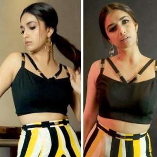 Keerthy Suresh raises the hotness bar in a black crop top and striped yellow and black skirt for Sarkaru Vaari Paata promotions