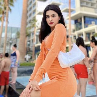 Avneet Kaur rocks an orange dress with thigh-high slit and Prada bag worth Rs. 1.45 Lakh on her trip to Dubai