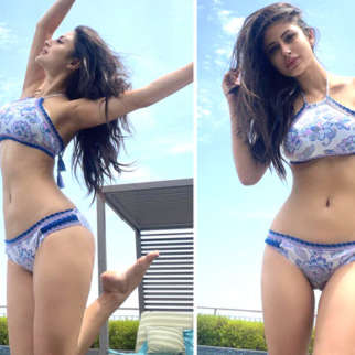 Mouni Roy looks smoking hot as she flaunts an incredibly toned physique in a white and blue printed bikini