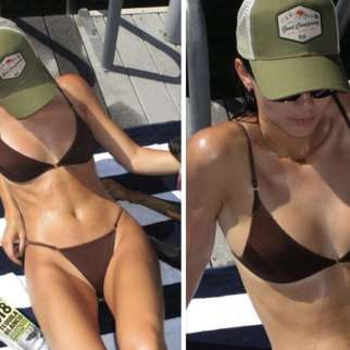 Kendall Jenner is making the most of sunny weather in a skimpy brown bikini