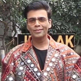 Karan Johar poses in funky mirrored jacket