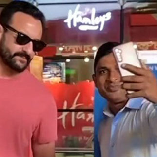 Saif Ali Khan poses with fans at the airport