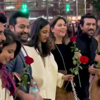 Ram Charan and Jr NTR walk with pride holding a rose on RRR's background music